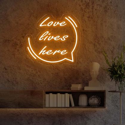 Space with 'Love Lives Here' Red LED Neon Sign