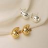 Add vintage charm to your look with our Chunky Gold & Silver Teardrop Earrings